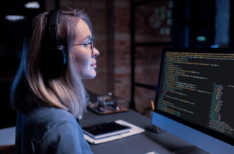 A female programmer working on the code