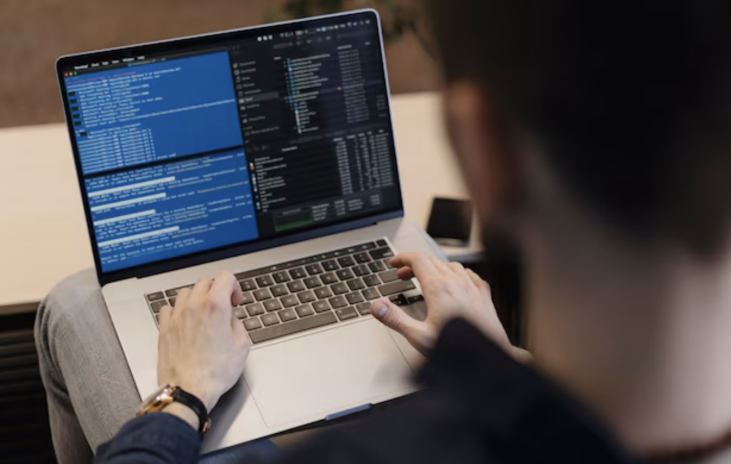A programmer writing a code